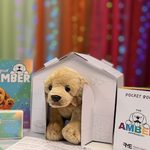 Bamber is snug in a little cardboard house